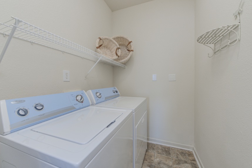 Laundry room with storage space in Greenwood.